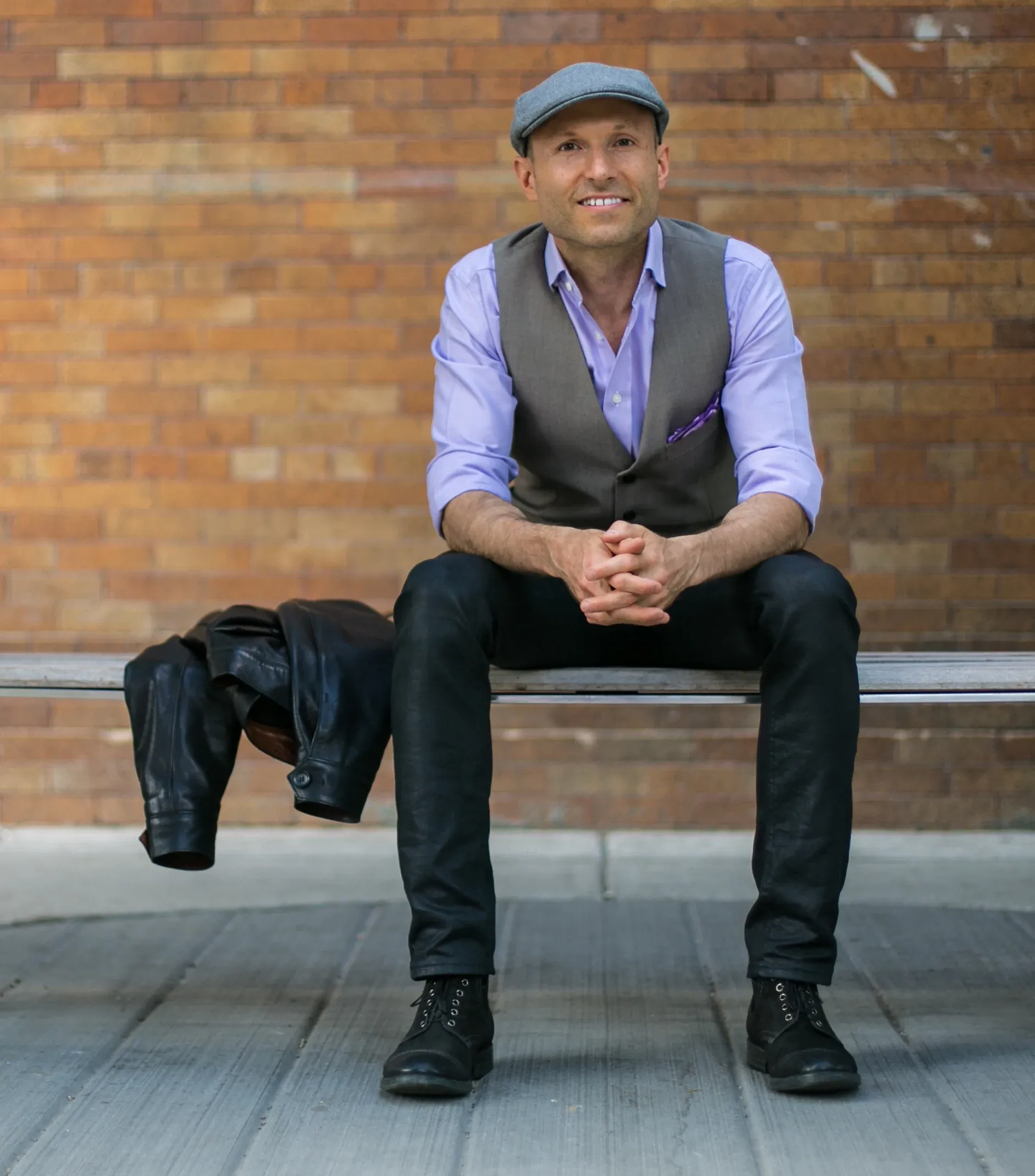 Burton Campbell, Founder and CEO of Werk One, seated on a bench
